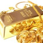 A fine Gold Bar surrounded by compliamenting jewelry.