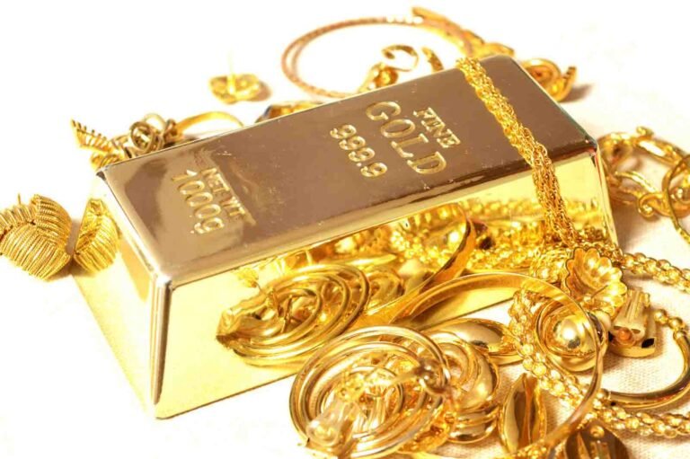 A fine Gold Bar surrounded by compliamenting jewelry.